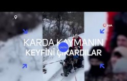 Kamyonet arkasına bağladıkları tekerlekle karda kaymanın keyfini yaşadılar